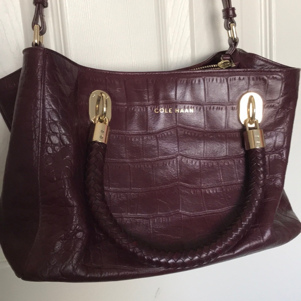 Cole haan burgundy leather purse. Gold details